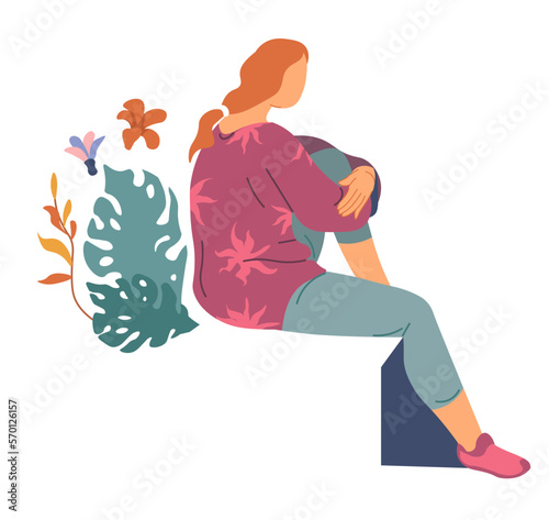 Woman with topical flowers and monstera leaves