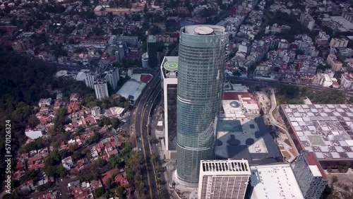 Orbital view taken with drone of the right side of an emblematic skyscraper in the south of Mexico City located on Rio Churubusco Avenue photo