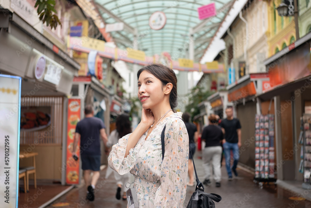 Woman traveling in Chinatown at Singapore city. Woman traveling in Chinatown at Singapore city.
