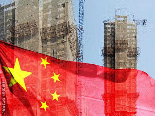 Double exposure creative hologram of unfinished supertall building and Chinese flag photo