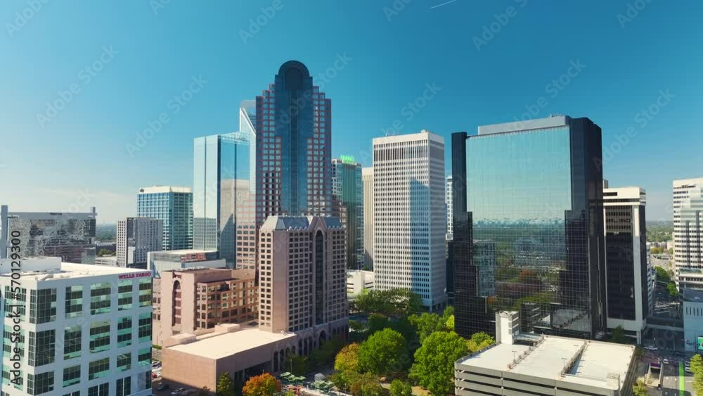 Urban landscape of downtown district of Charlotte city in North Carolina, USA. Skyline with high skyscraper buildings in modern american megapolis Urban landscape of downtown district of Charlotte city in North Carolina, USA. Skyline with high skyscraper buildings in modern american megapolis