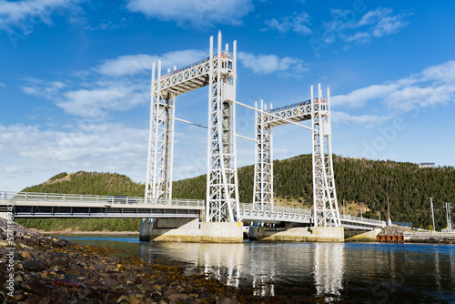 Fototapeta Naklejka Na Ścianę i Meble -  The Sir Ambrose Shea Lift Bridge standing tall over a body of water along the East Coast of Canada at Placentia Newfoundland.
