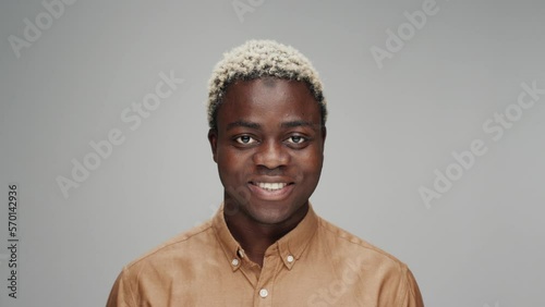 Portraits of People Men Looking at Camera on Grey Background Close up. Modern Concept of Mixed Races or Multiethnic Diversity of Joyful Together. Ethnicity of Afro Male with Small Boy and Older Human