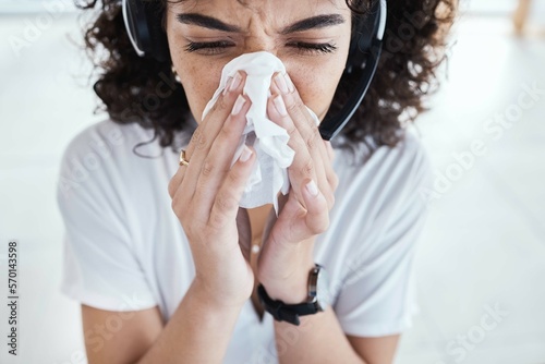 Photos Call center, customer support and woman blowing her nose with tissue for a cold, flu or covid