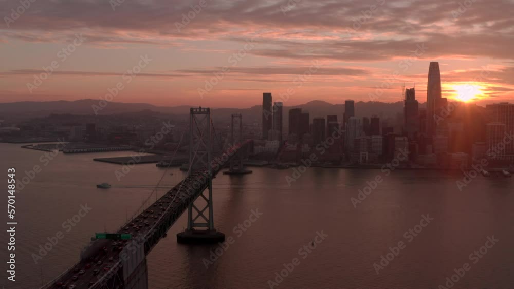 Aerial shot along Bay Bridge towards downtown San Francisco at sunset Aerial shot along Bay Bridge towards downtown San Francisco at sunset