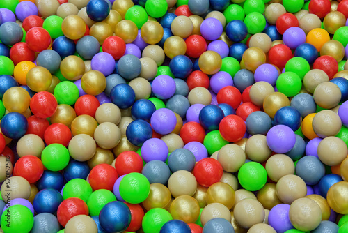 A bunch of colorful plastic balls in the game center. View from above. A place to copy