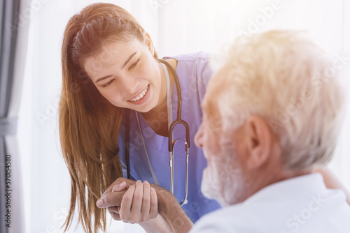 Nurse doctor working at home care medical checkup healthy elderly senior male happy smile
