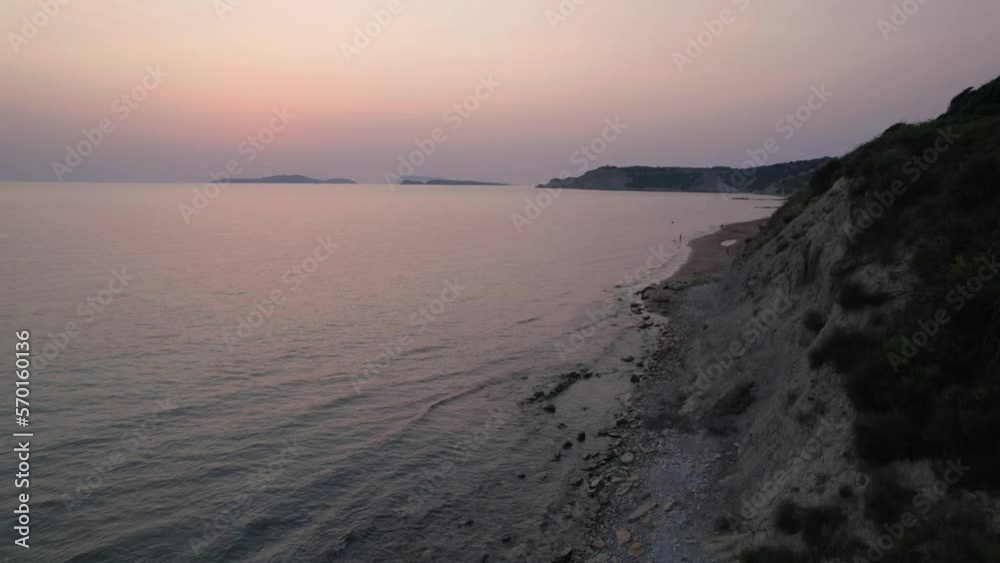 Establishing aerial drone shotof people enjoying the beach at Arillas, Corfu, Greece Establishing aerial drone shotof people enjoying the beach at Arillas, Corfu, Greece