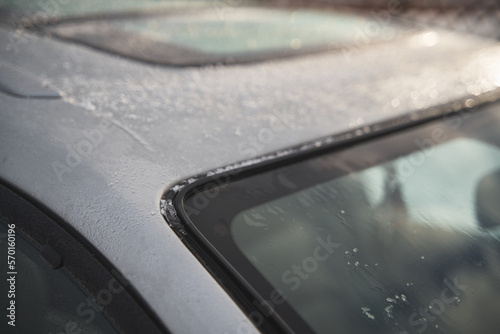 Frozen car at parking lot. Frost on car windows, frosted glass. Frost on side car window.