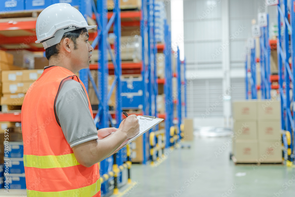 asian man business owner using checklist recheck amount of stock product inventory on shelf at distribution warehouse factory.logistic business ship and delivery, inventory flow, professional. asian man business owner using checklist recheck amount of stock product inventory on shelf at distribution warehouse factory.logistic business ship and delivery, inventory flow, professional.