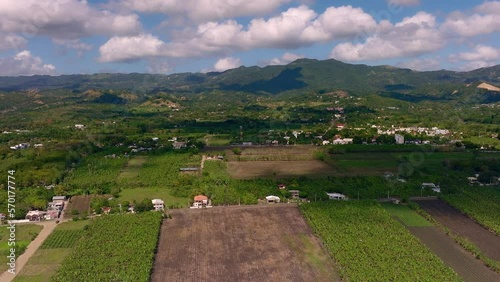 Moca countryside in Espaillat province, Cibao region of Dominican Republic. Aerial forward photo