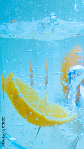 Summer orange cocktails with citrus fruits on an orange background. lemonade, refreshing drinks, low alcohol non-alcoholic cocktails, summer party concept.