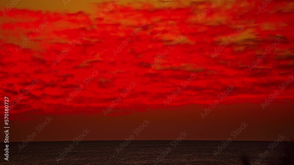 Red sky sunrise cloudscape time lapse over the Red Sea in Egypt