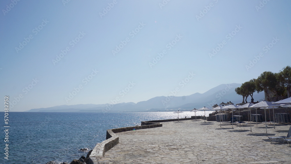 Mediterranean Sea and mountain Deserted beach. Relaxing aerial beach scene, summer vacation holiday template banner. Amazing blue sea shore, coastline. Chill deserted stone beach, seaside. 