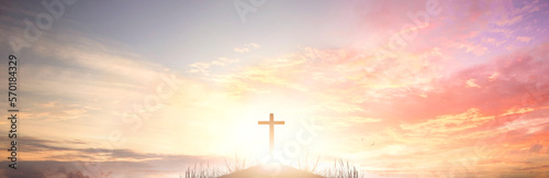 The cross of God in the rays of the sunset background © paul