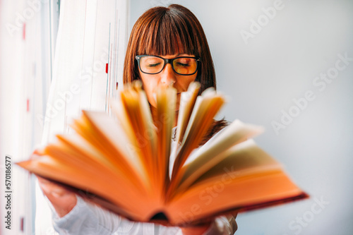 Girl with a reading book photo