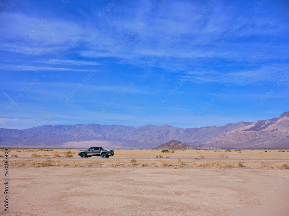 A toyota truck parked on the side of a Death Valley desert highway A toyota truck parked on the side of a Death Valley desert highway