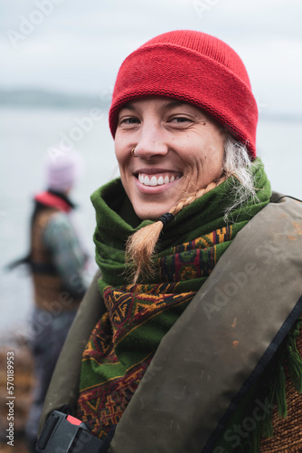 Happy woman smiles with beautiful white teeth on boat jetty photo