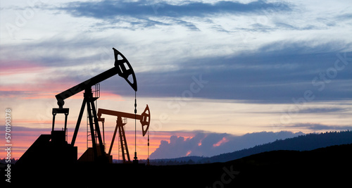 The change in oil prices caused by the war. Oil prices are rising because of the global crisis. Oil drilling derricks at desert oilfield. Crude oil production from the ground.