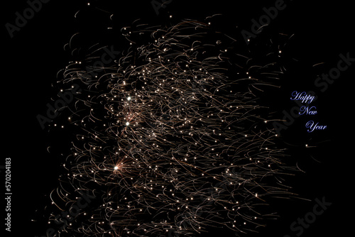 Real fireworks photography and abstract colorful fireworks background with Happy New Year lettering