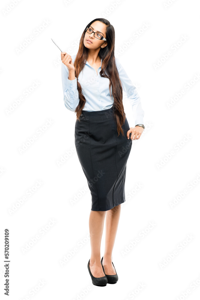 An attractive young indian girl in business formals or a coach or a persoanl assistant pointing at a copy space with a pen isolated on a png background. An attractive young indian girl in business formals or a coach or a persoanl assistant pointing at a copy space with a pen isolated on a png background.
