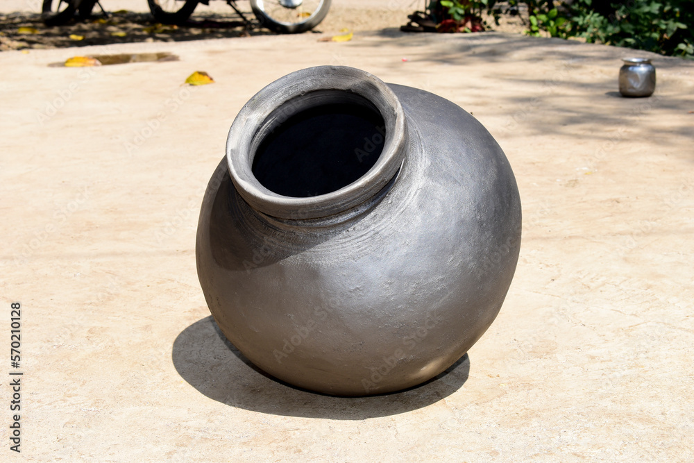 Indian handmade ou or earthen pot or a clay pot, A earthen pot with cold water Indian handmade ou or earthen pot or a clay pot, A earthen pot with cold water