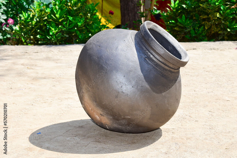 Indian handmade ou or earthen pot or a clay pot, A earthen pot with cold water Indian handmade ou or earthen pot or a clay pot, A earthen pot with cold water