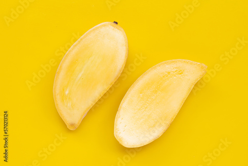 Tropical fruit, Mango on yellow background. Top view