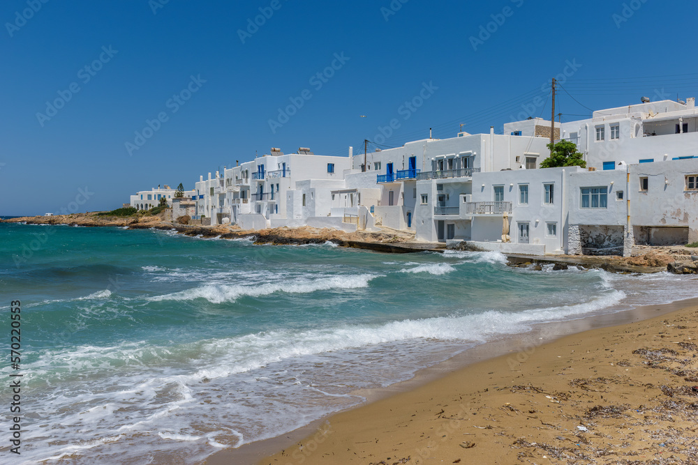 Traditional Cycladitic view of whitewashed houses beside the sea in Naousa  Paros island, Greece