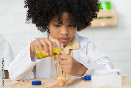 African American child girl scientists learning science and analyse liquid in the laboratory. Science and education, researcher and discovery concept