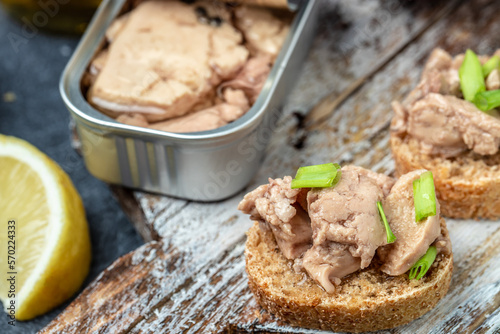 Cod liver over brown bread with green onion, Food recipe background. Close up