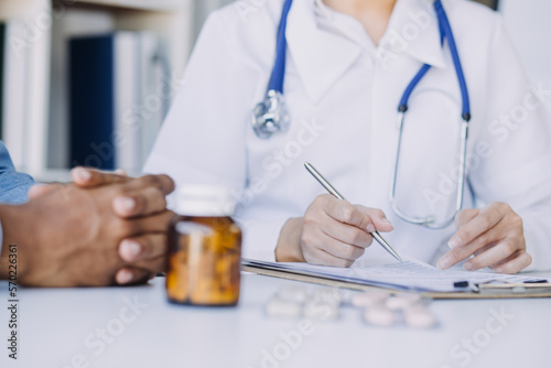 Male Doctor writing out RX prescription, copy space, consent contract sign prescribe a remedy healthy lifestyle healthcare Online medical service concept