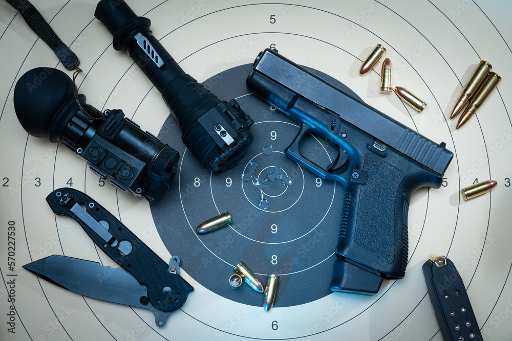 9mm compact pistol, targets for shooting with bullet holes in the