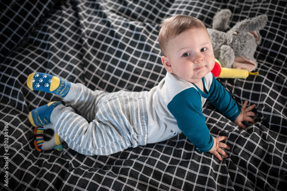 Naklejka premium Portrait view of cute baby boy. Joy and happiness concept. Love and family emotion