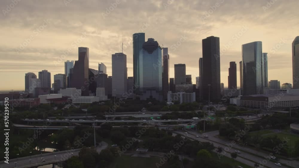 Aerial -Steady shot of Houston skyline at sunrise with traffic Aerial -Steady shot of Houston skyline at sunrise with traffic