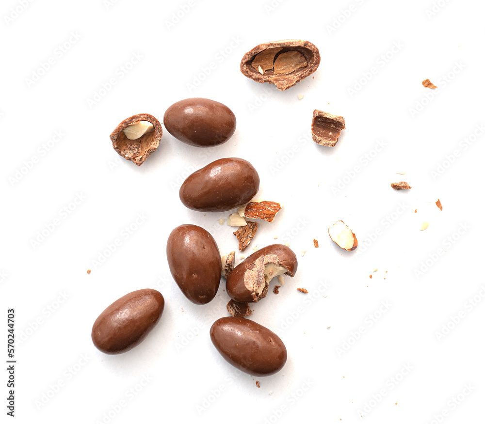 Round and broken small chocolate candies with almond, nuts as filling isolated on white, top view Round and broken small chocolate candies with almond, nuts as filling isolated on white, top view