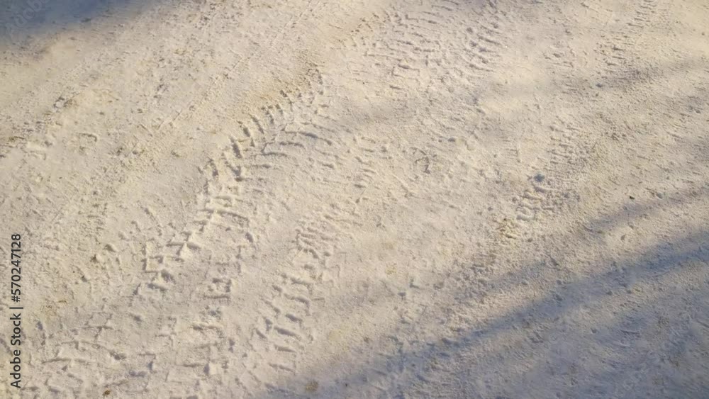 tire tracks in the snow. frozen tire tires in ice. frozen tire tracks