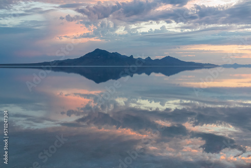 Scenic view of beautiful mountains reflecting in lake of Bonneville Salt Flats at sunrise  Wendover  Western Utah  USA  America. Looking at summits of Silver Island Mountain range. Romantic atmosphere