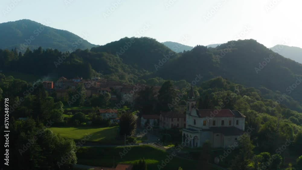 Aerial View Of Scenic Italian Village Located Beside Forested Hills In Arola, Italy. Slow Circle Dolly Aerial View Of Scenic Italian Village Located Beside Forested Hills In Arola, Italy. Slow Circle Dolly