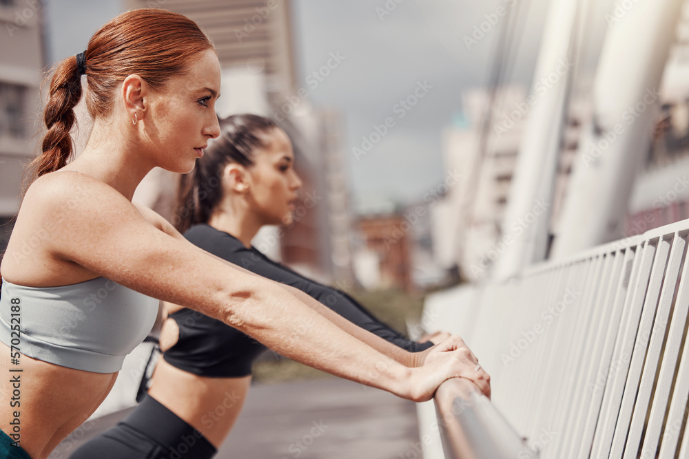 Fitness, woman and personal trainer in city stretching for outdoor workout on bridge for health and wellness. Sports, motivation and mindset, urban training and people stretch together for exercise.