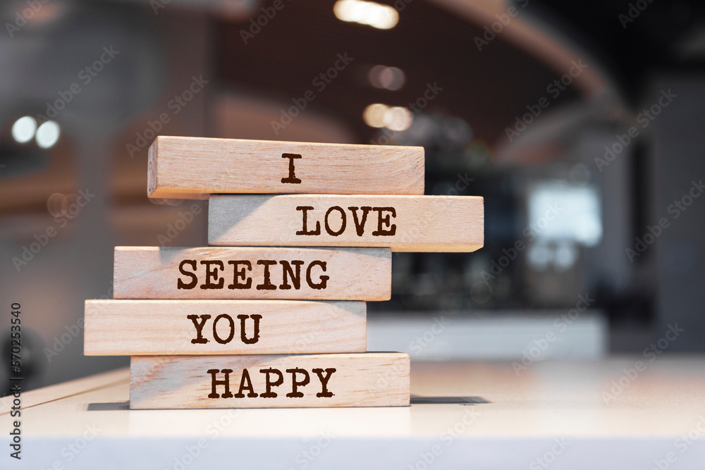 Wooden blocks with words 'I love seeing you happy'.