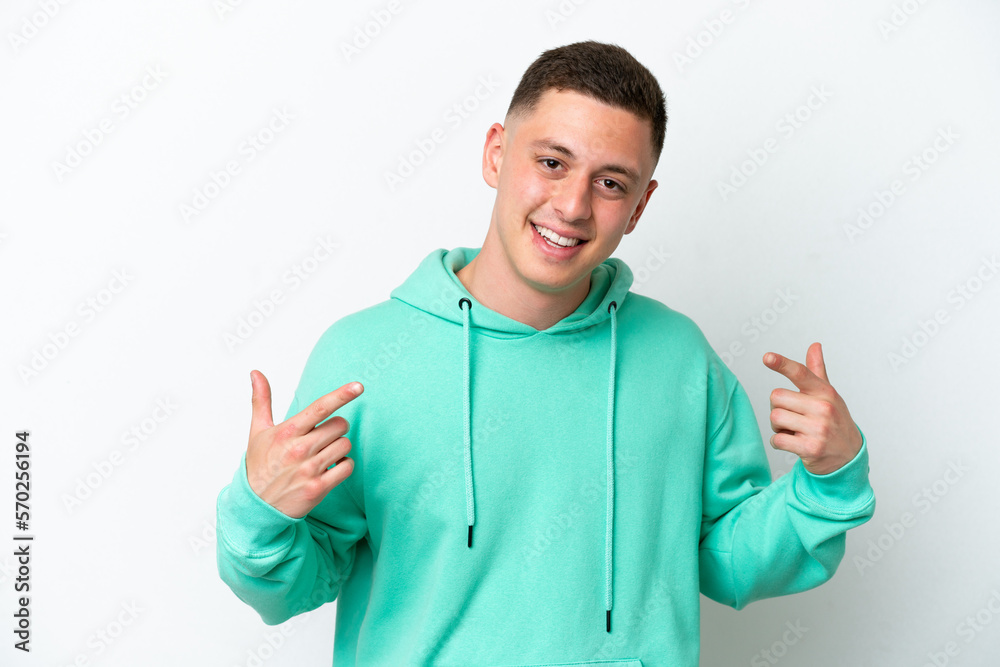 Fototapeta premium Young brazilian man isolated on white background giving a thumbs up gesture