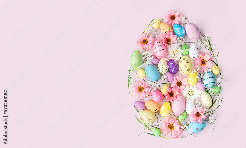 Easter egg shape with flowers and decorated eggs on pink background with copy space. Creative layout concept for greetings card for the holiday season. Easter egg shape with flowers and decorated eggs on pink background with copy space. Creative layout concept for greetings card for the holiday season.