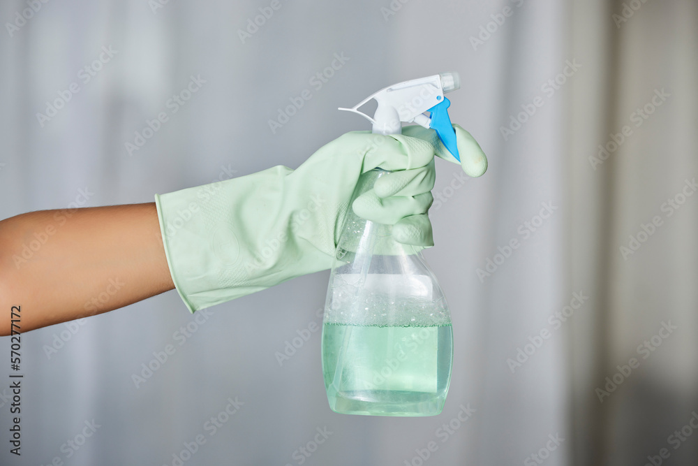 Spray bottle, detergent and maid with gloves for cleaning in a house, office or apartment. Hygiene, cleaner service and hand of a housekeeper with liquid for housework or sanitize dust, dirt or germs Spray bottle, detergent and maid with gloves for cleaning in a house, office or apartment. Hygiene, cleaner service and hand of a housekeeper with liquid for housework or sanitize dust, dirt or germs