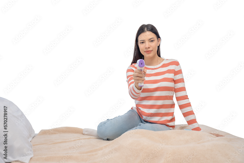 Beautiful woman sitting in bed using a thermometer. Beautiful woman sitting in bed using a thermometer.