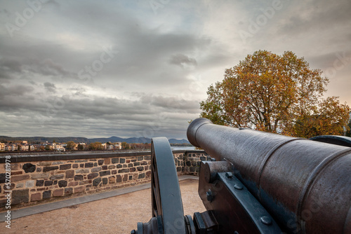 Picture of the old cannon on the alter zoll am rhein in Bonn, overlooking the rhine river. The Alter Zoll, or old customs, is part of the park on the Bonn fortifications of dreikoningen. photo