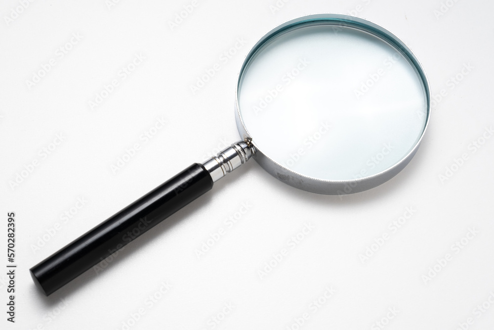 Magnifying Glass with Black Handle on a White Background Magnifying Glass with Black Handle on a White Background