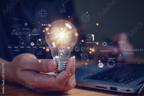 Man holding light bulb, global internet connection, business global internet connection technology and digital marketing, digital connected technology, big data, finance and banking