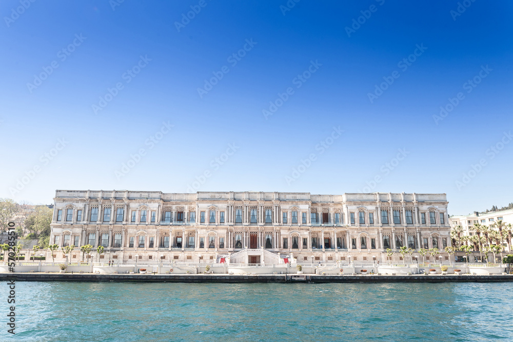 Ciragan Palace on the Bosphorus strait in summer. Ciragan palace, or Ciragan Sarayi is a 19th century ottoman palace and a major landmark of Istanbul..