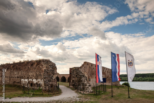 Flags of Serbia and Sabac in front of the Sabac fortress. Also called Sabacka Tvdjava, this fortress is a former castle from the Ottoman medieval era in Sabac, Serbia. photo